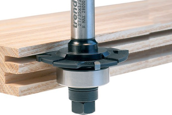 Slotting and grooving router cutters, also known as arbor-mounted cutters, consist of single or multiple slotting cutters (also called “groovers”) assembled on an arbor, using spacers, shims, and ball-bearing guides to adjust their proximity and depth of cut.