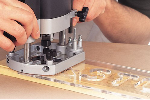 Routing using a jig or template for lettering or numbers 