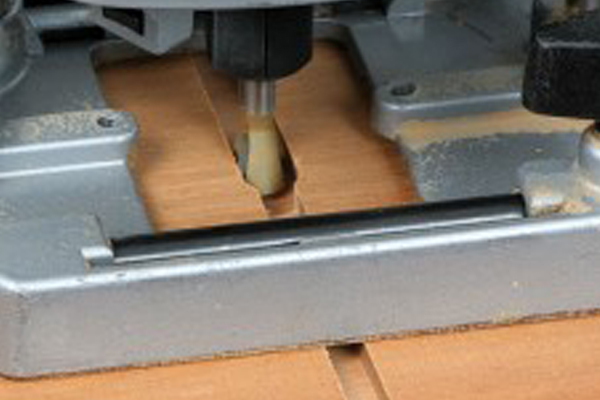 In routing, the term "roughing out" refers to the quick removal of waste material prior to the finishing cuts. 