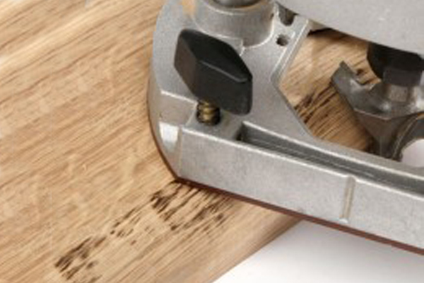 back cutting with a router is cutting in the opposite direction to the rotation of the router cutter