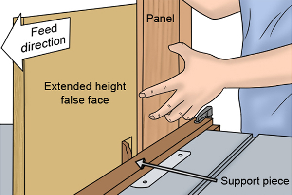 DIYer using an extended height fence to support a panel being cut on a router table by a vertical raised panel router cutter