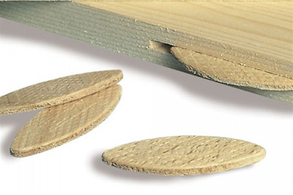 An example of an unassembled biscuit joint with the groove and biscuit clearly visible