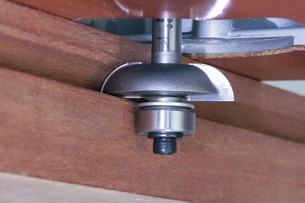 mounted guides on router cutter help to control the cuts 