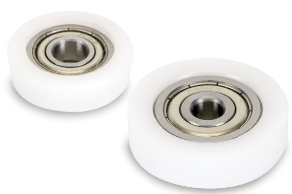 Bearings for bits with plastic sleeves for use with bits used with solid surface materials