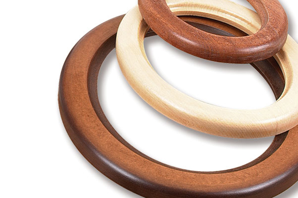 Wooden rings with rounded edges produced by an ovolo router cutter