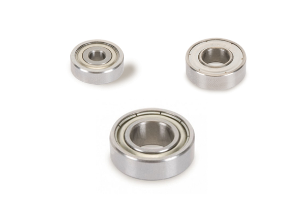 Examples of ball bearing guides for use with finger jointing router cutters