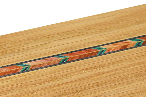 A groove created by a router cutter and inlaid with stringings