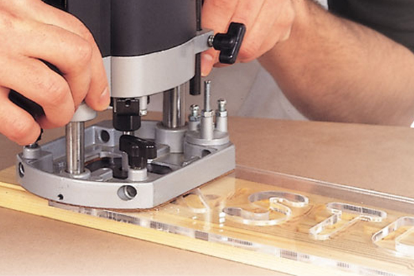 A spiral router cutter used in conjunction with a template