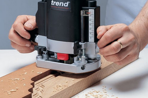 A hand-held router that can be used with a variety of cutters